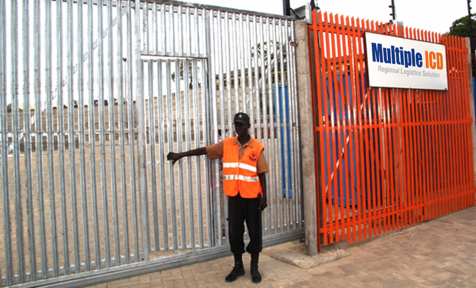 Staff member at the depot gate beside the current Multiple ICD sign