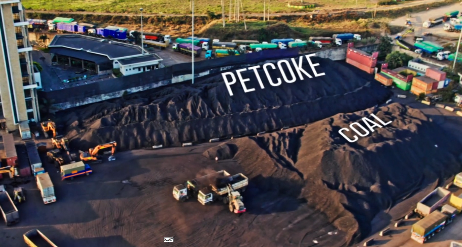 Aerial view of petcoke and coal stockpiles at the bulk cargo yard